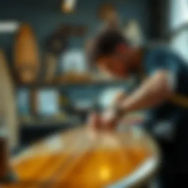 Artisan shaping a resin tint surfboard