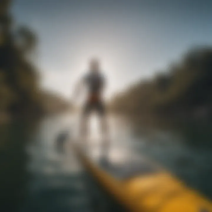 An individual demonstrating proper paddling technique on a paddleboard in an open water setting.