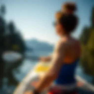 Enjoying the Paddle Boarding Experience User enjoying a paddle boarding experience on a calm lake