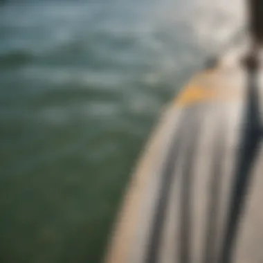 A close-up of a paddle board measuring tape next to different board lengths.