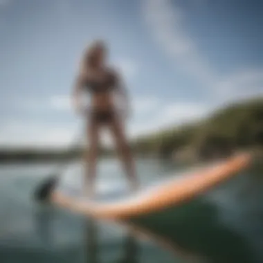 A paddle boarder demonstrating technique and posture on the water.