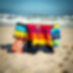 A selection of vibrant board shorts displayed on a sandy beach