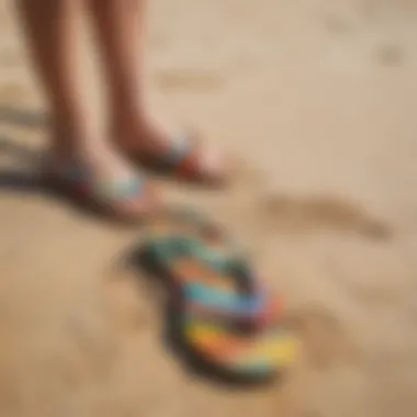 Vibrant rainbow sandals on a sandy beach