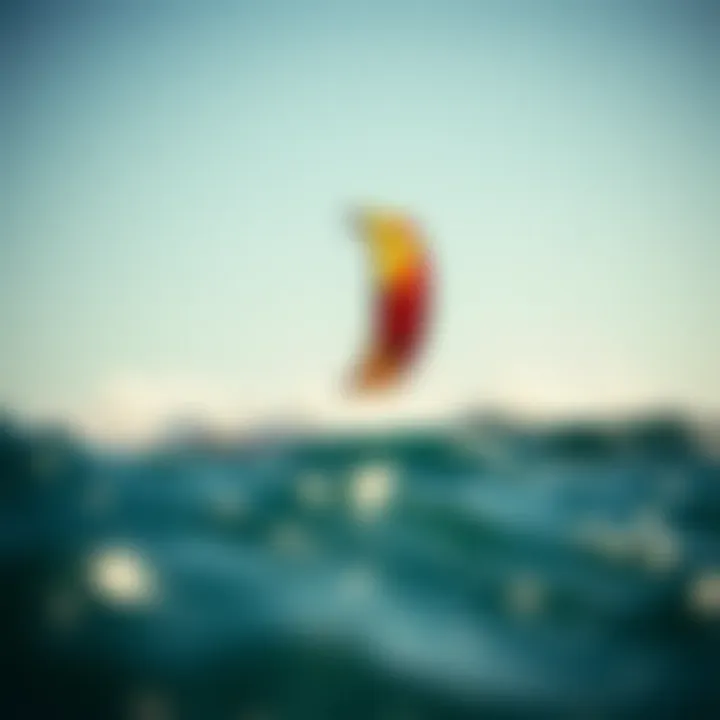 A vibrant duotone kite soaring above the ocean waves