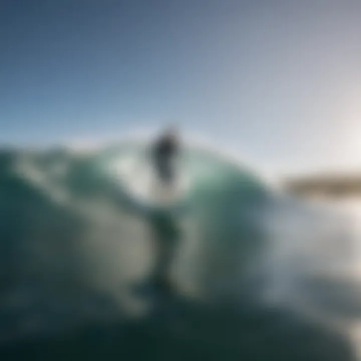 Scenic view of a surfer catching a wave on an inflatable SUP