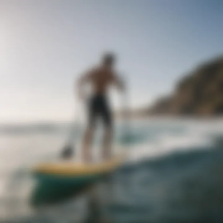 Side view of a surfer balancing on an inflatable paddleboard