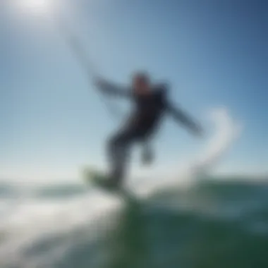 A kite surfer expertly navigating the waves under a clear blue sky