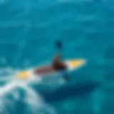 A Morey paddle board gliding through clear blue waters