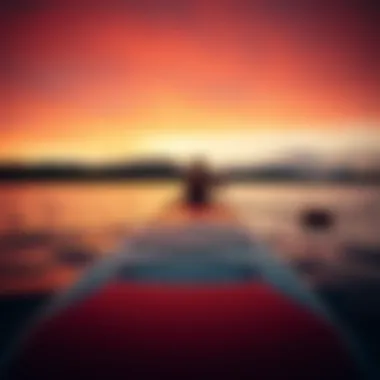 A serene landscape showcasing a Morey paddle board at sunset