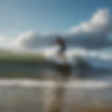 A picturesque beach scene capturing surfers riding waves under a clear blue sky.