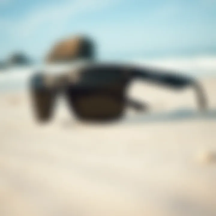 Close-up view of stylish surf sunglasses on a sandy beach