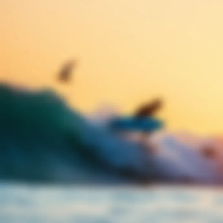 Surfer catching a wave at sunset