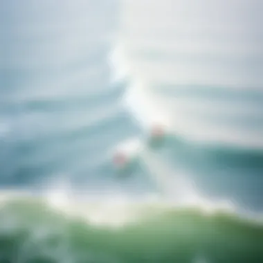 Surfers Riding Waves An aerial view of surfers riding different waves
