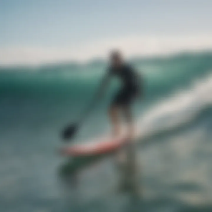 Surfer riding a wave with paddle board