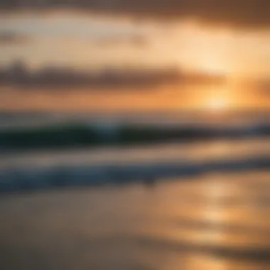 A vibrant sunset over Cocoa Beach with surfers in the water