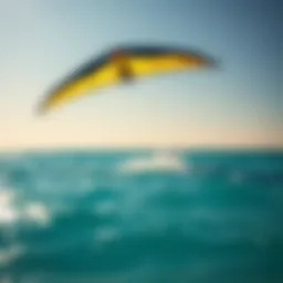 A wing kite soaring above turquoise waters during a sunny day