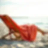 A stylish towelling poncho draped on a beach chair