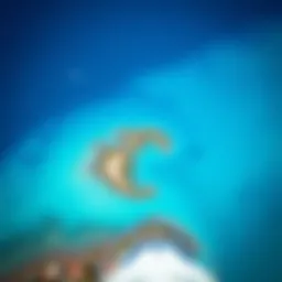 Aerial view of a coastal region showcasing the vibrant blue ocean contrasting with land.