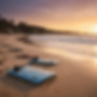 A serene beach setting at sunset with boogie boards resting on the sand