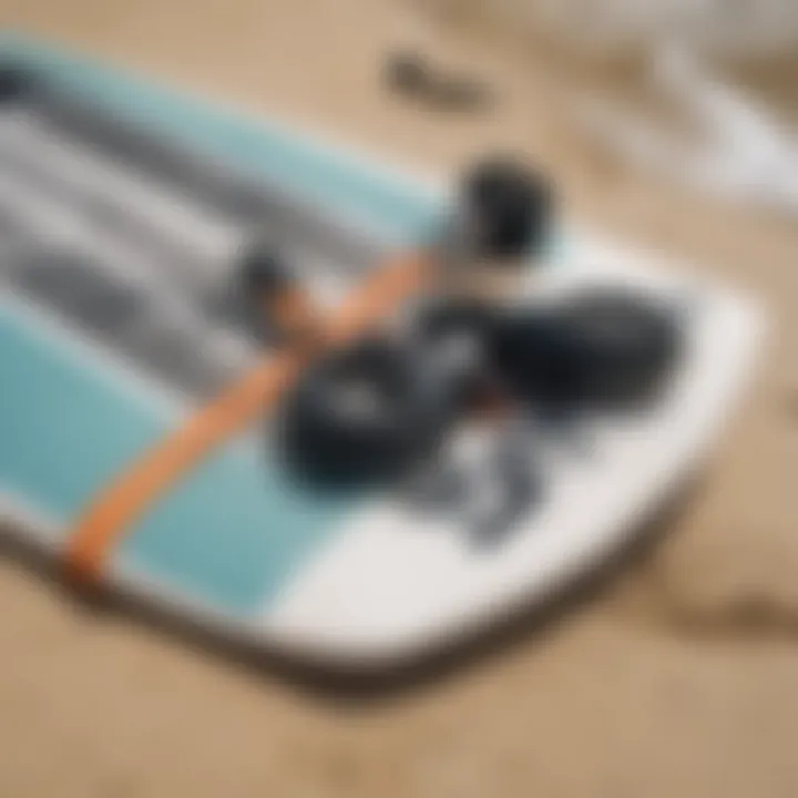 Close-up of wake surfing equipment laid out on the beach