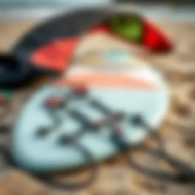 A close-up of essential kite surfing gear laid out on the beach, including a kite, harness, and board.