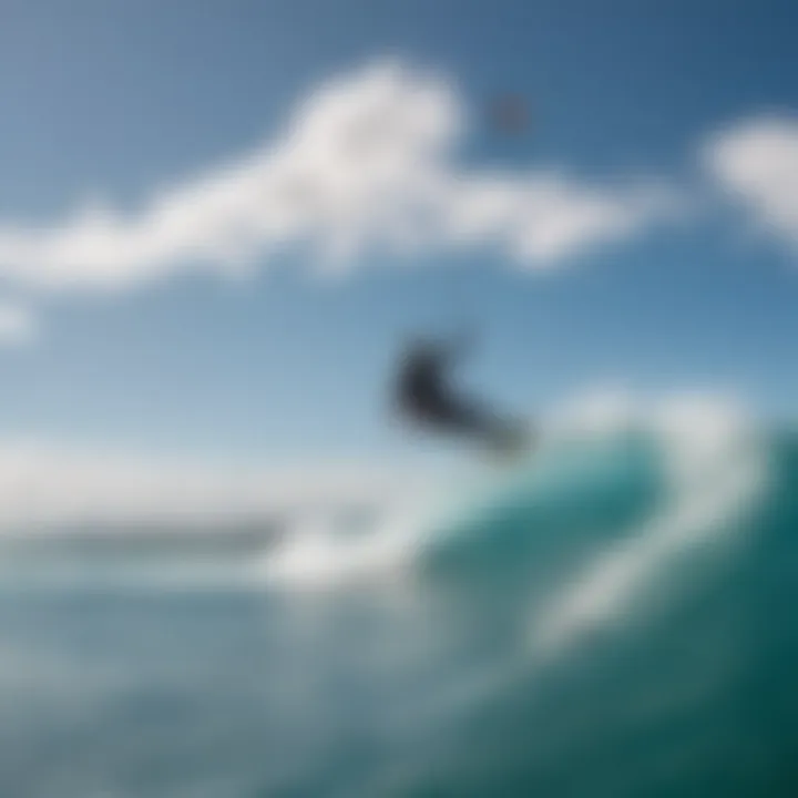 Kitesurfers navigating the waves under a clear blue sky