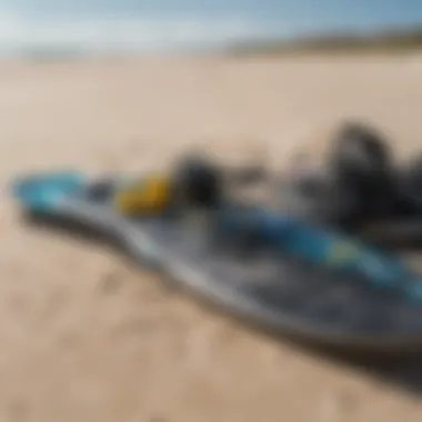 Close-up of kitesurfing equipment laid out on the beach