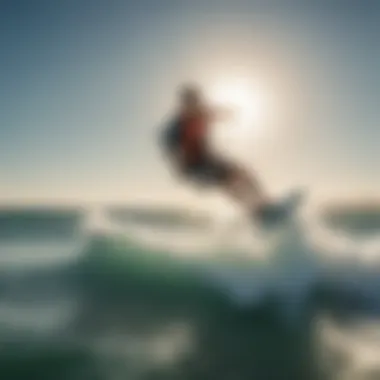 A kitesurfer gliding over vibrant blue waters