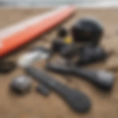 Close-up of essential surfing equipment laid out on the beach