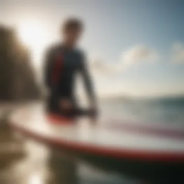 An individual inspecting a surfboard for quality and condition