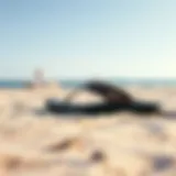 Stylish Reef Newport sandals on a sandy beach