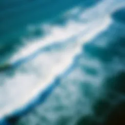 Aerial view of the San Diego coastline with waves crashing on the shore