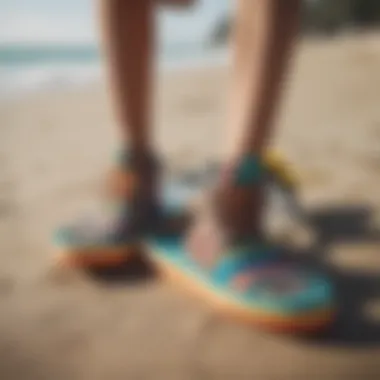 Colorful Sanuk footwear next to a surfboard