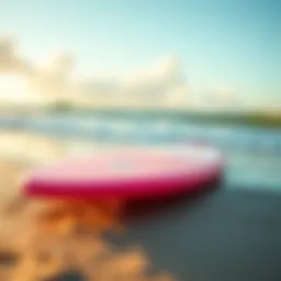 A vibrant short foam surfboard on the beach