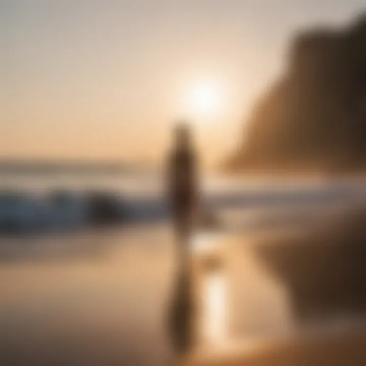 A surfer practicing yoga on the beach at sunrise