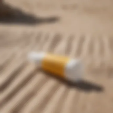 Essential Sunscreen for Watersport Enthusiasts Close-up of Sun Bum Daily Mineral Sunscreen Moisturizer tube on a beach towel