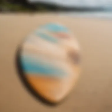 A collection of various skimboards on a sandy beach showcasing their unique designs.